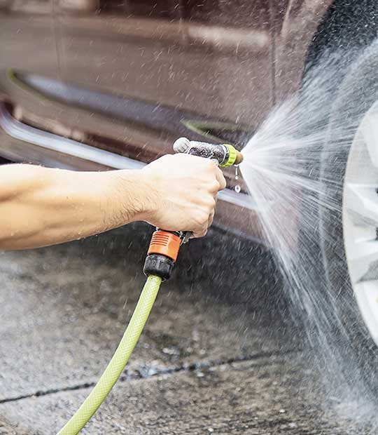 washing with garden pipe